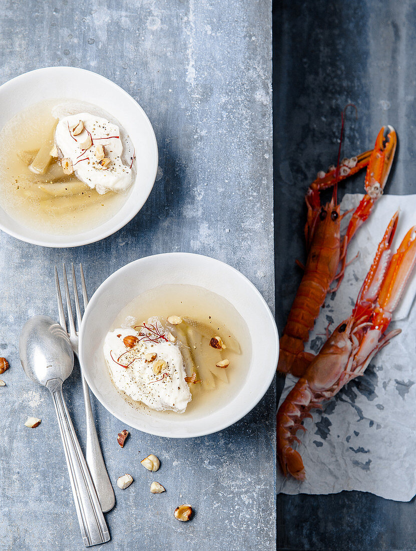 Langoustine broth with artichokes and hazelnuts