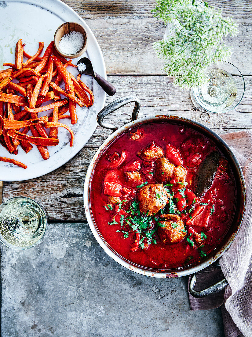 Lamb balls with tomatoes and fresh herbs, served with french fries