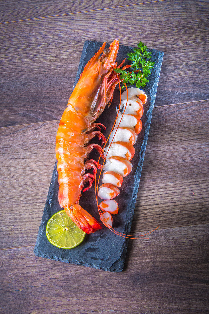 A giant prawn on a slate plate