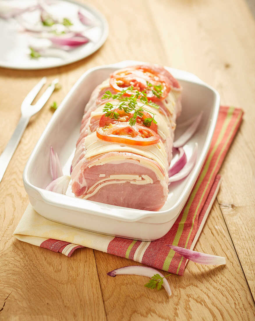 Raw roast veal 'Prince Orloff' with bacon and cheese