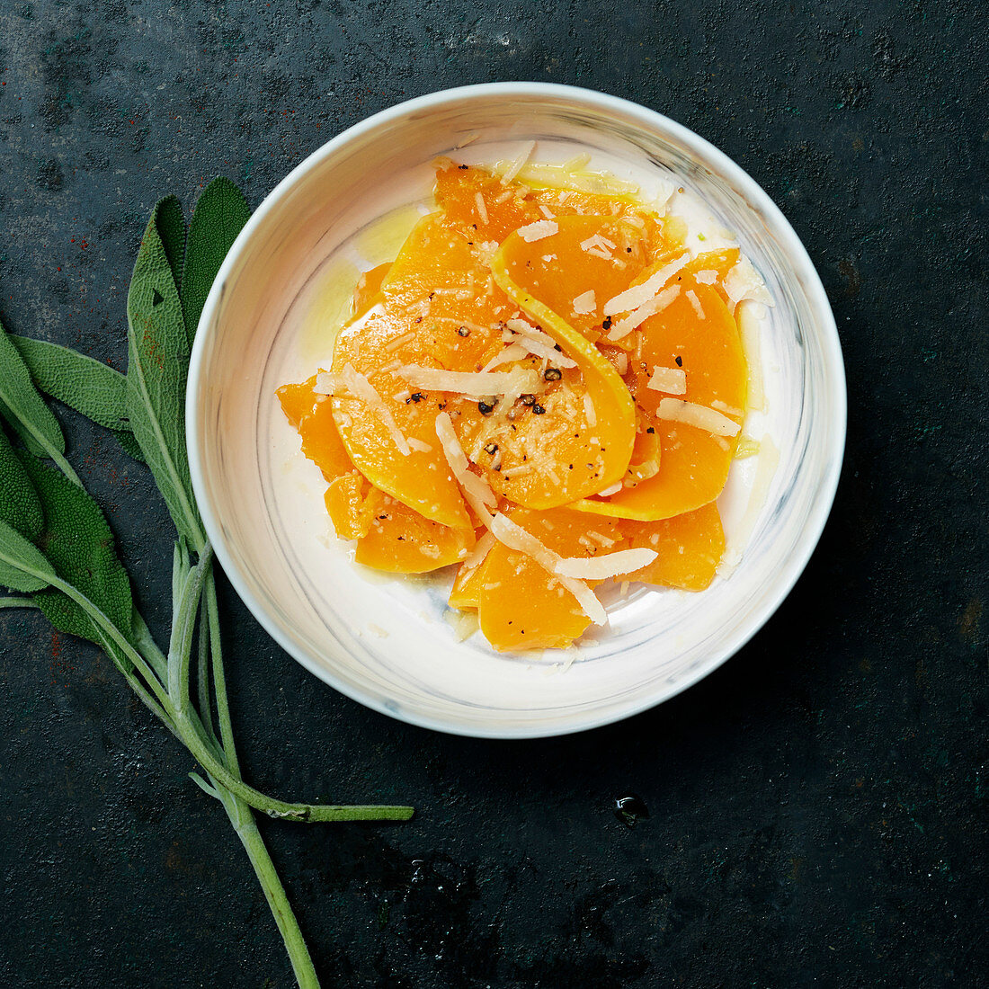 Sweet potatoes with peppers and parmesan shavings