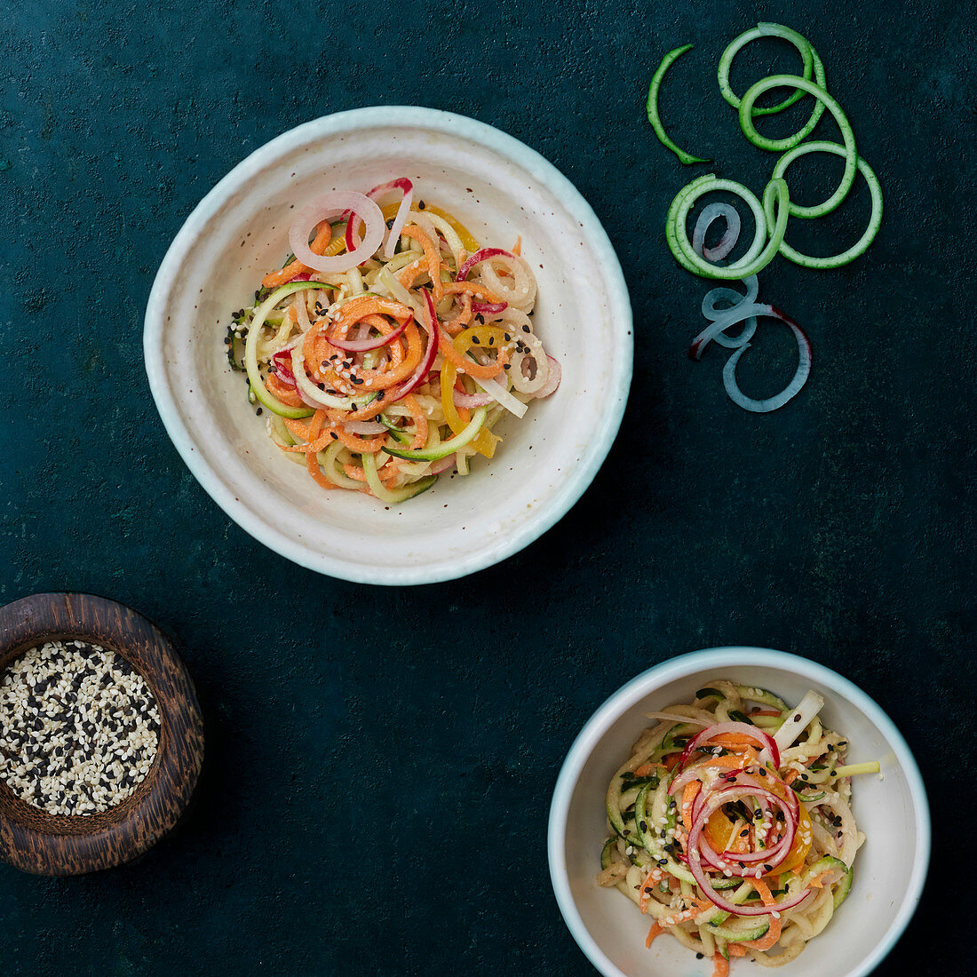 Vegetable spaghetti salad made with courgette and carrots, with sesame seeds