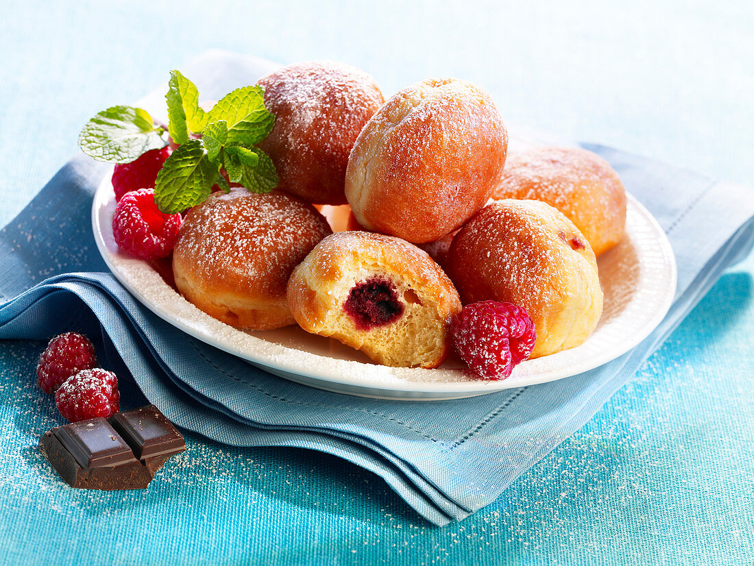 Small doughnuts with raspberry jam