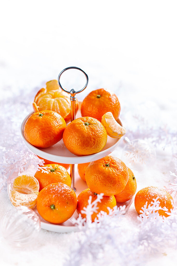 Clementines on a Christmas cake stand