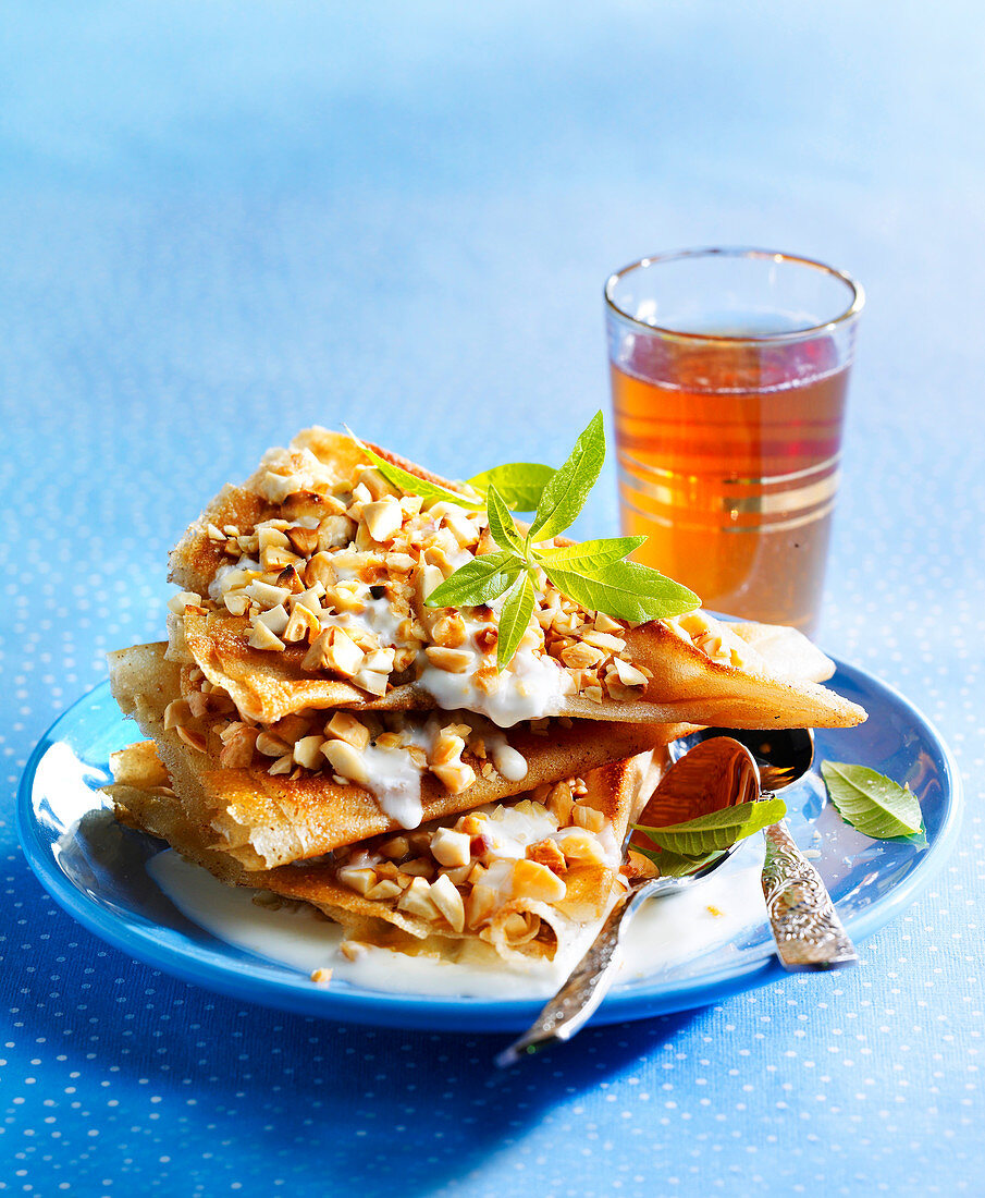 Sweet pastilla with hazelnuts and a glass of mint tea (Morocco)