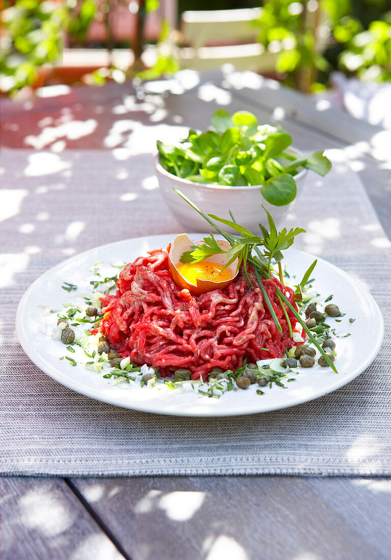 Beef tartare on an outdoor table