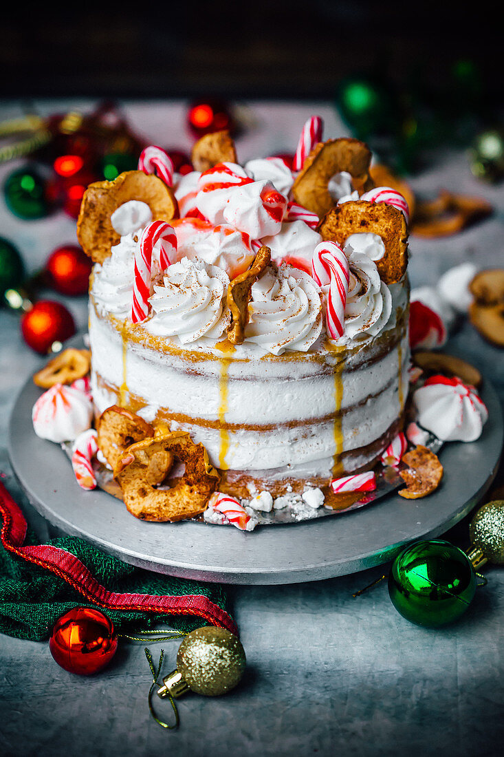 Christmas gingerbread cake with apple rings and candy canes