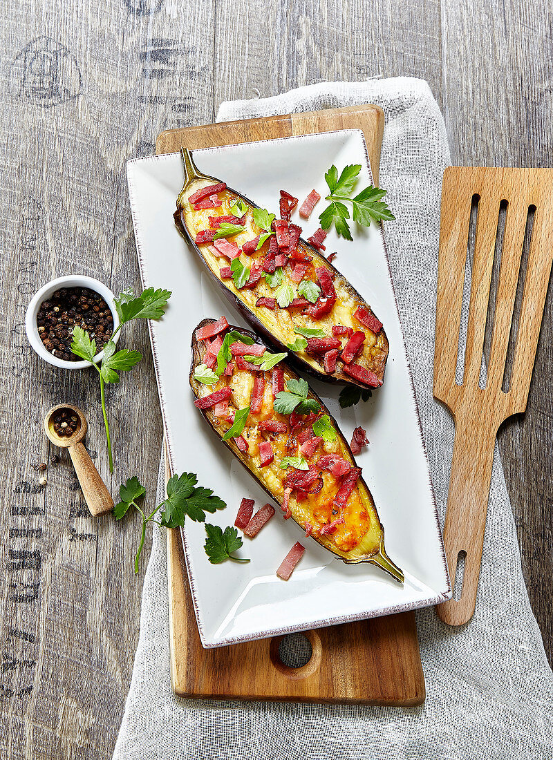 Stuffed aubergines with Comté and bacon cubes