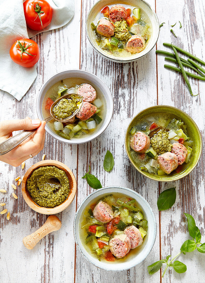 Summer vegetable soup with pistou and sausage