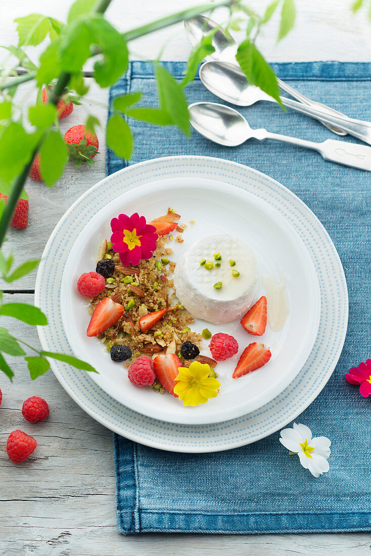 Goat’s cheese served with caramelised semolina with berries and flowers