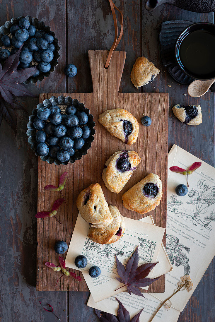 Scones with blueberries on a wooden board