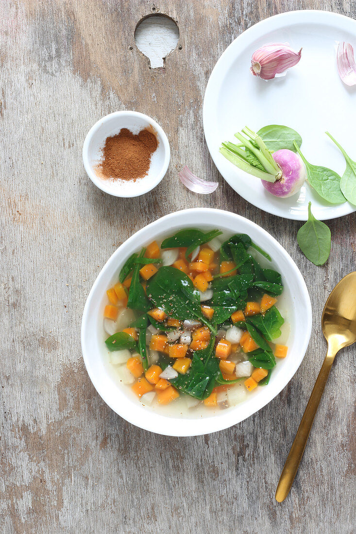 Detox vegetable broth with spinach, carrots and turnips