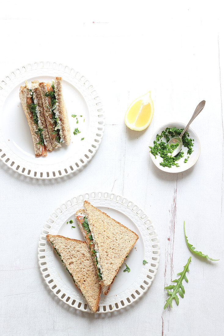 Club sandwich with smoked salmon and fresh herbs