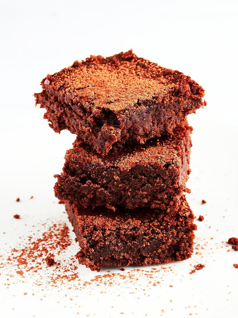 Three brownies with hazelnuts