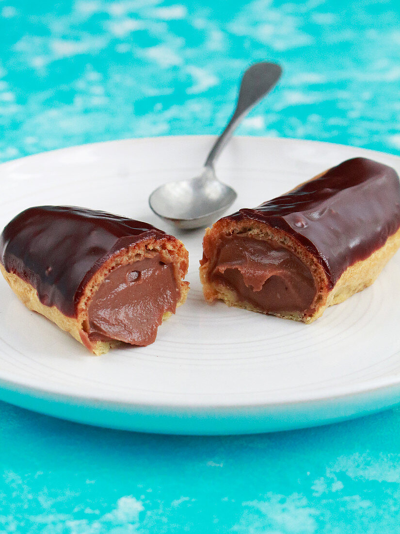 Éclair with chocolate cream filling and chocolate icing