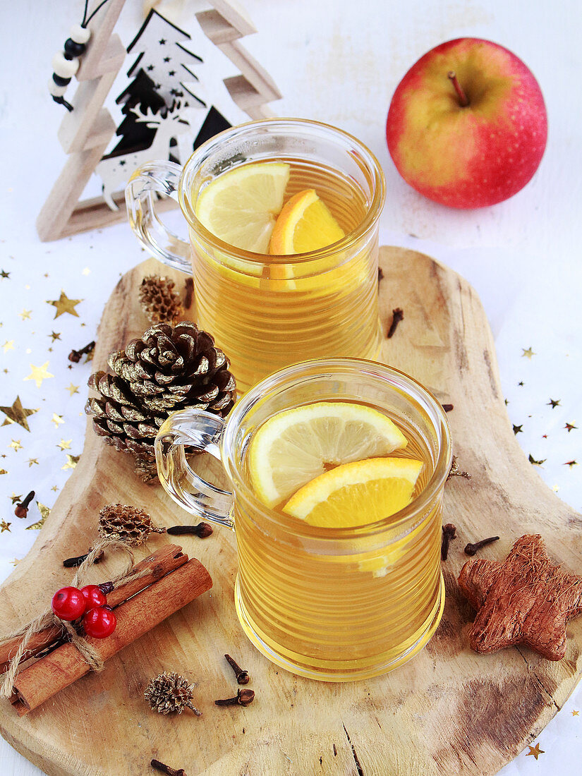 Hot apple drinks with spices and lemon