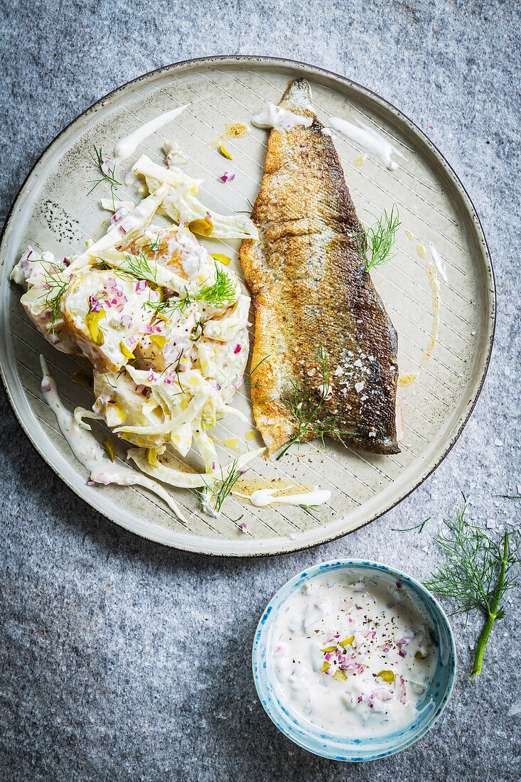 Fried fish with potato and fennel salad