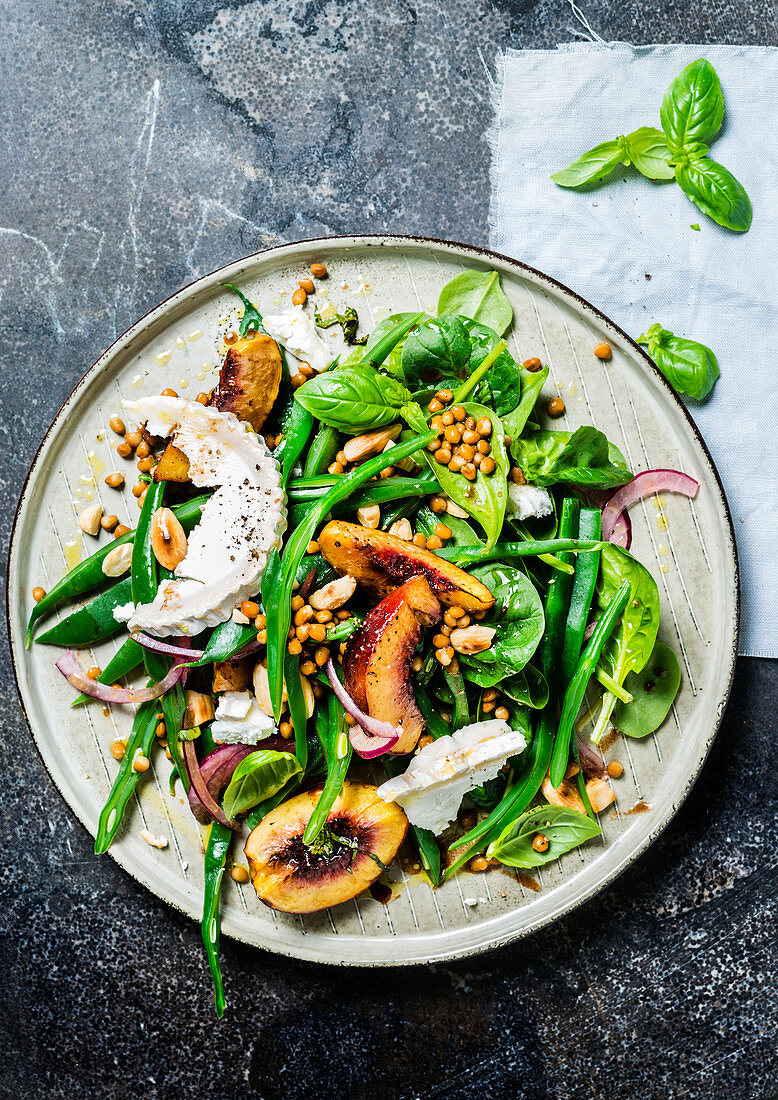 Green bean salad with roasted peaches, lentils and goat’s cheese