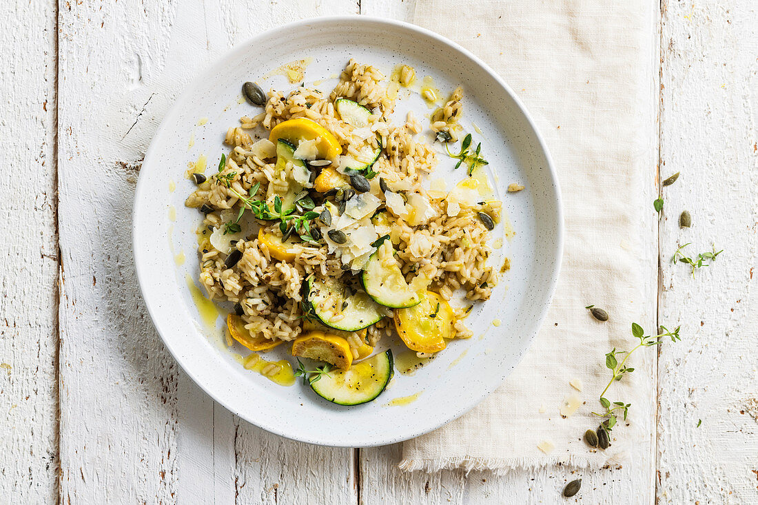 Risotto with yellow and green courgettes and pumpkin seeds