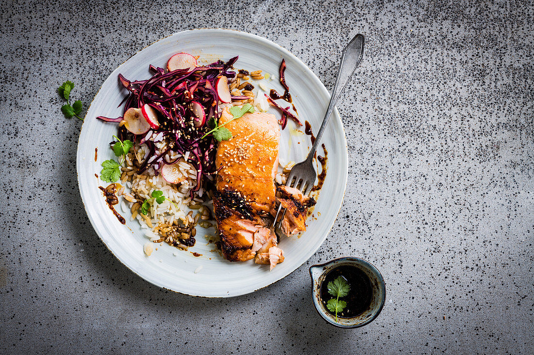 Salmon steak with red cabbage kimchi and rice salad (Korea)