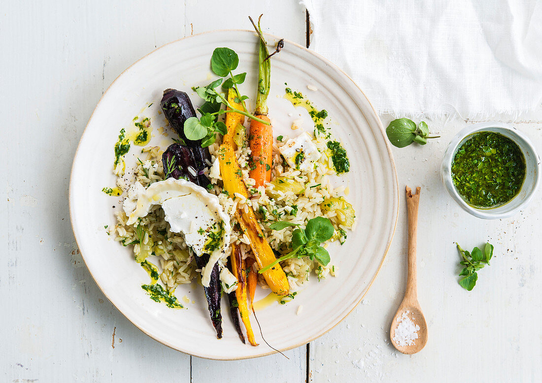 Pilaf with colourful carrots, goat’s cheese and herb sauce