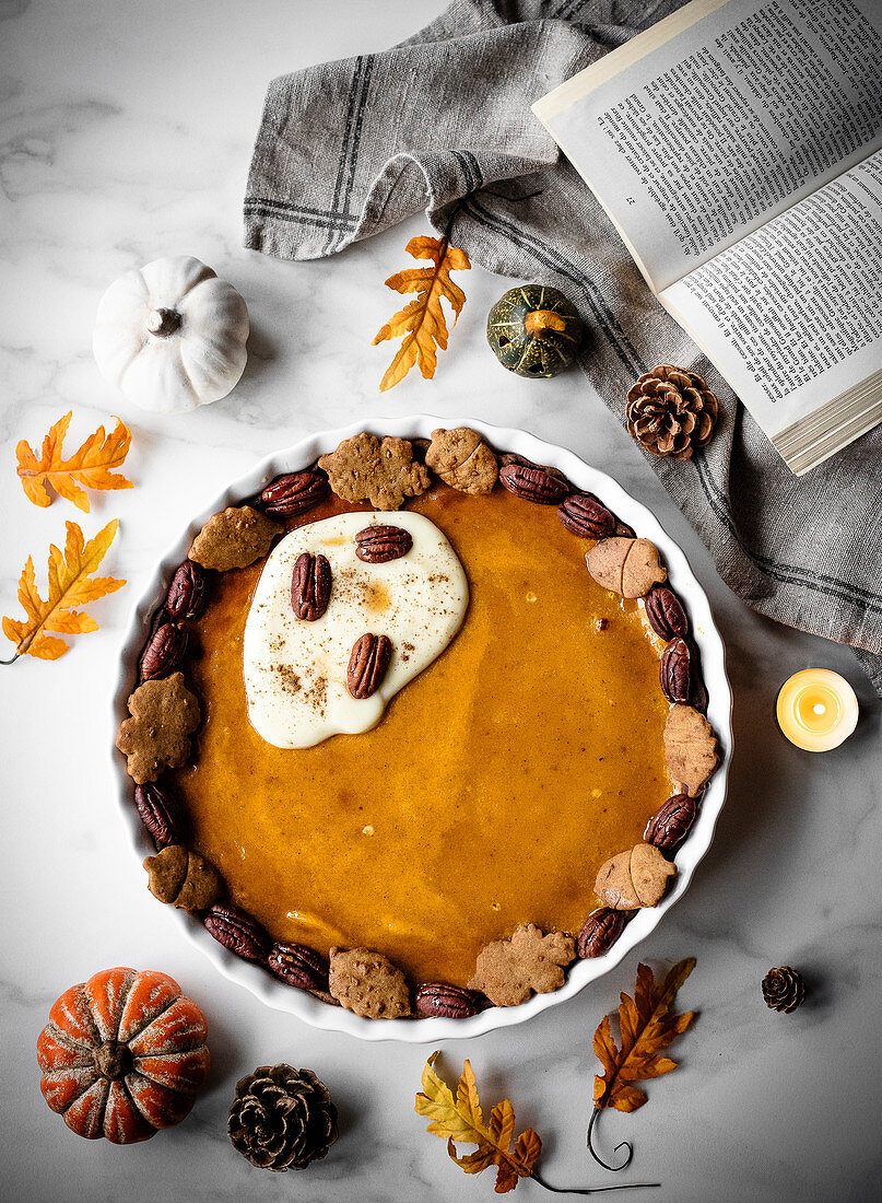 Autumn pumpkin pie with maple syrup and pecans