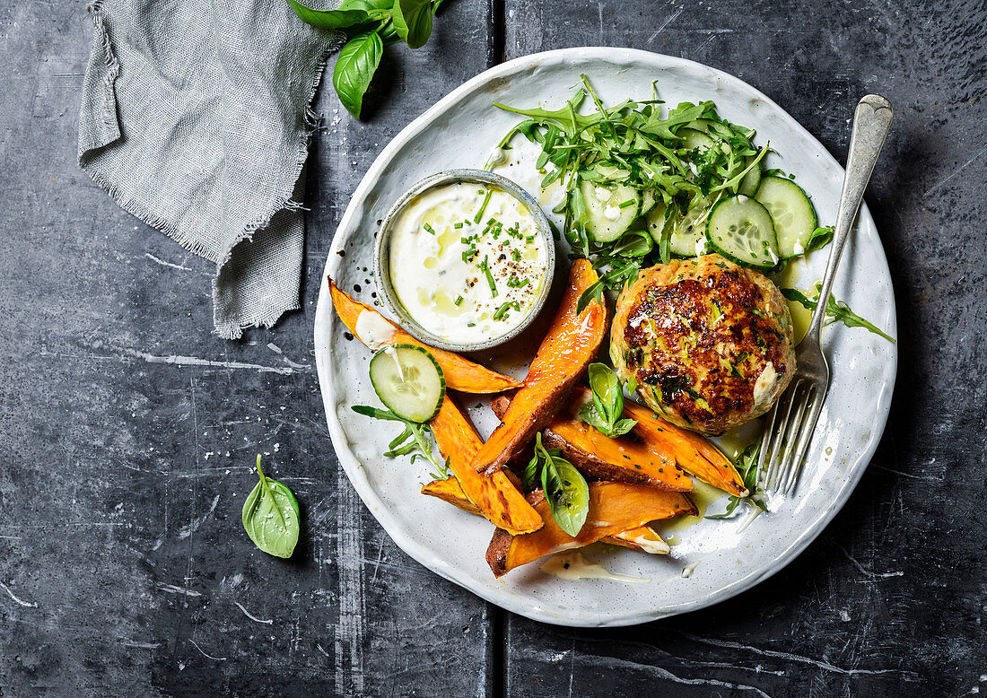 Chicken burger with cucumber and roasted sweet potatoes
