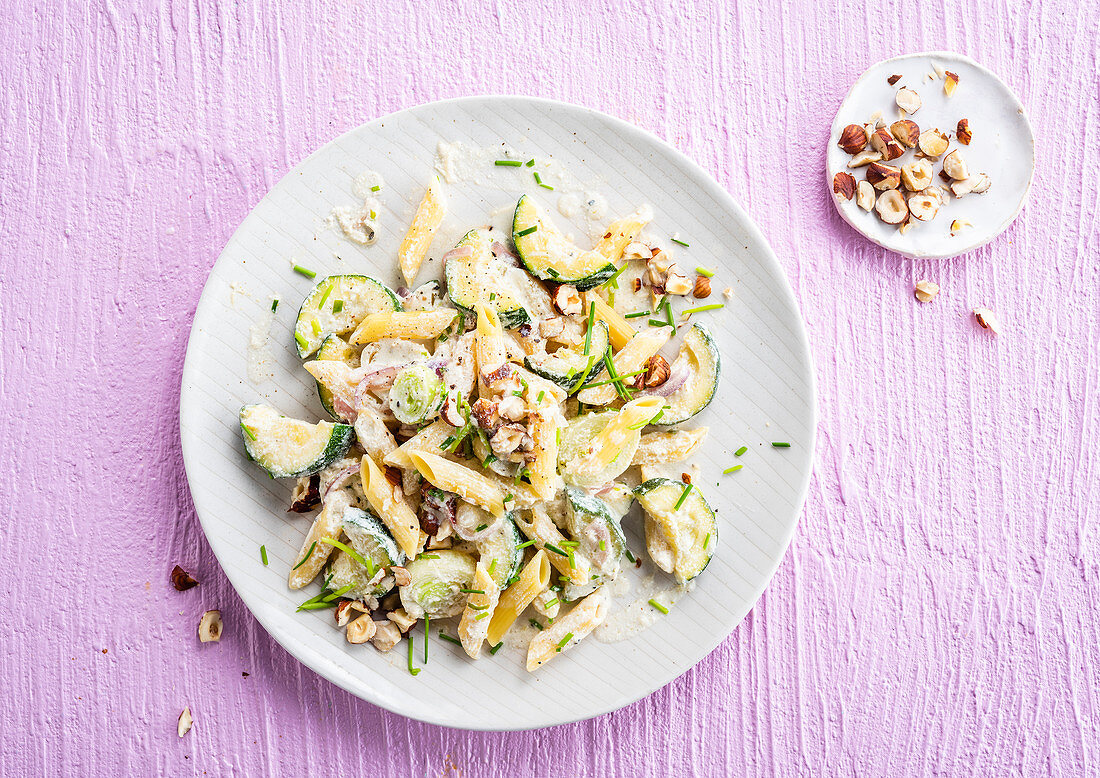 Penne with ricotta cream, courgette, leek and hazelnuts