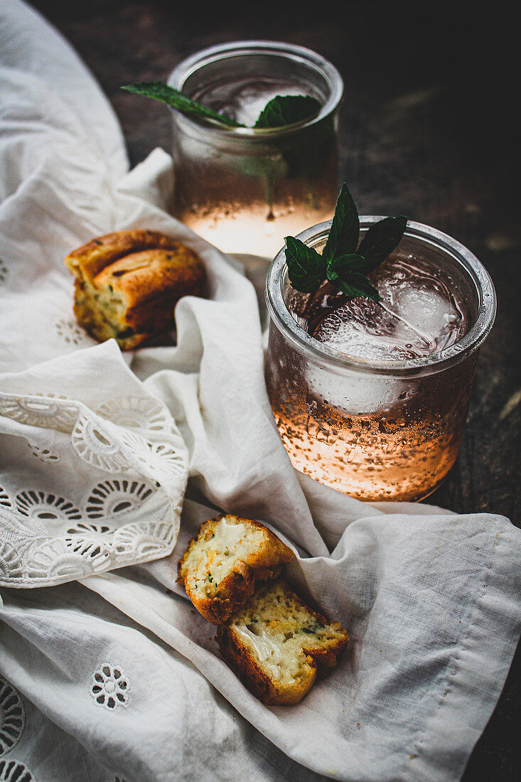 Strawberry cocktails with mint served with savoury mini cakes