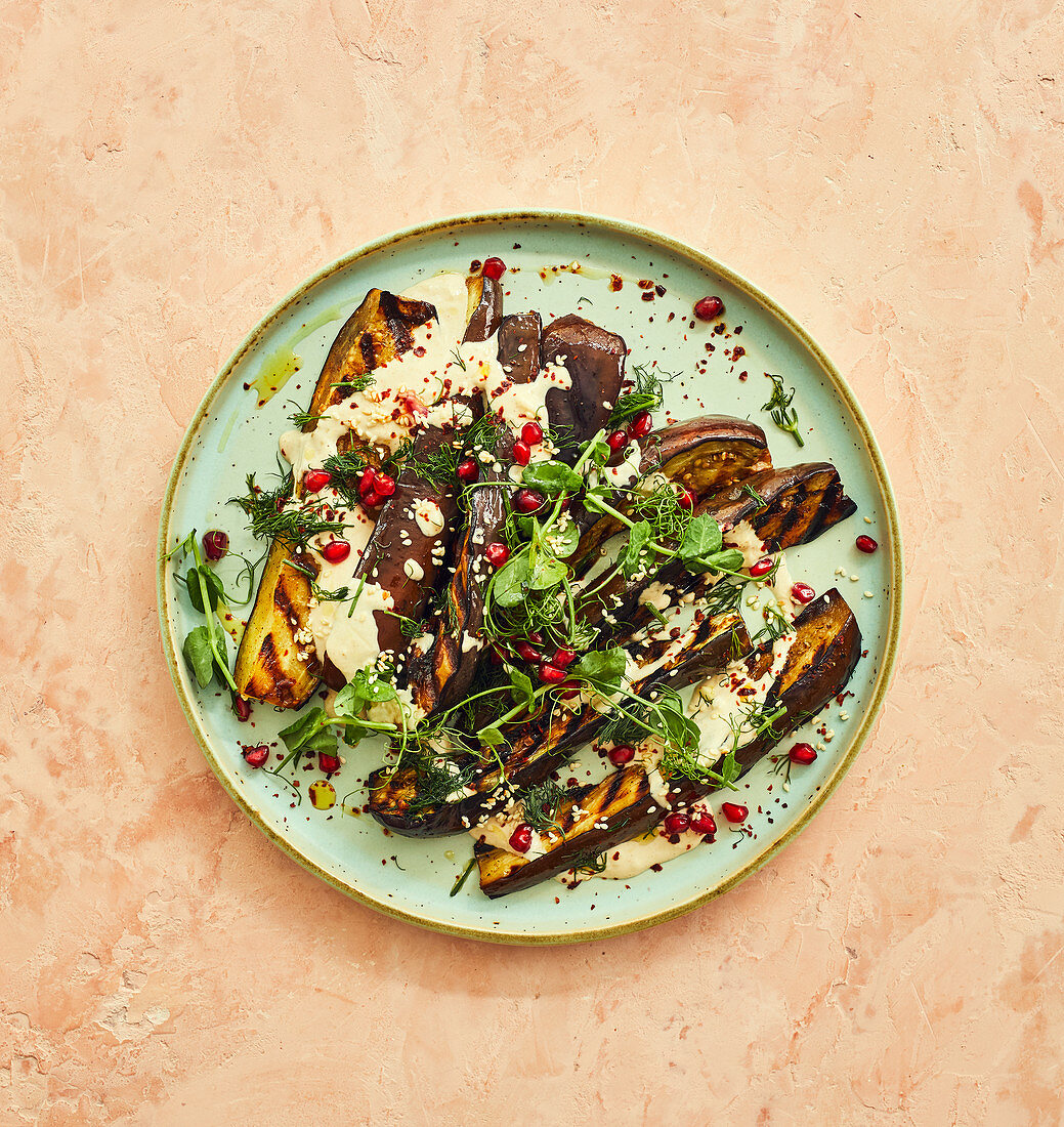 Grilled aubergines with tahini sauce and pomegranate seeds