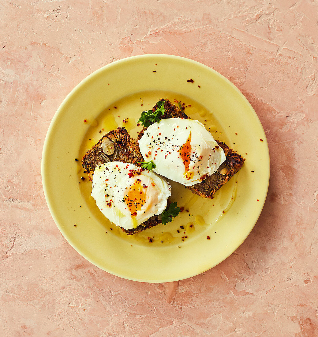 Grain bread slices with poached eggs