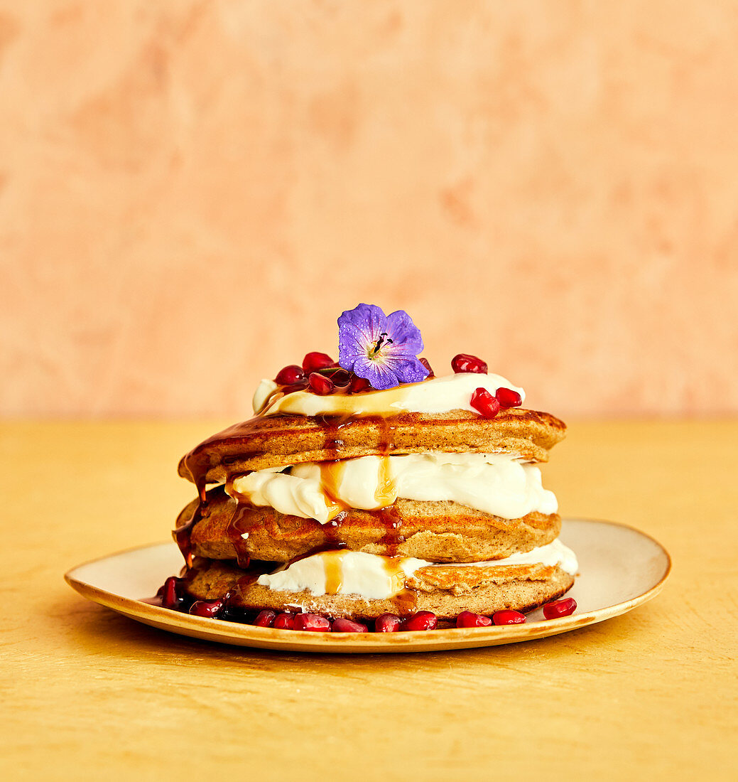 Pancake stack with ricotta and pomegranate seeds