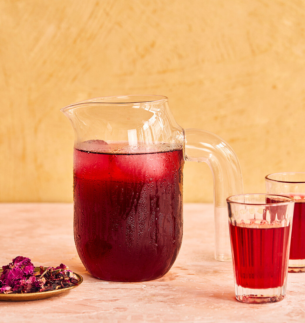 Red iced tea in a jug and glasses