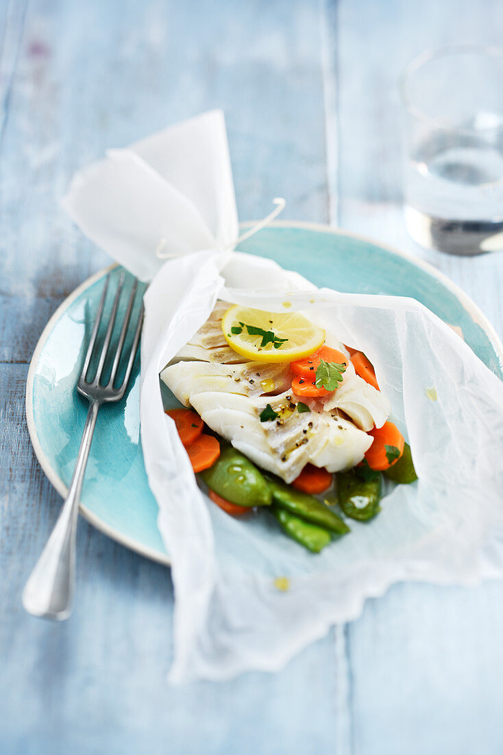 Cod with vegetables in paper