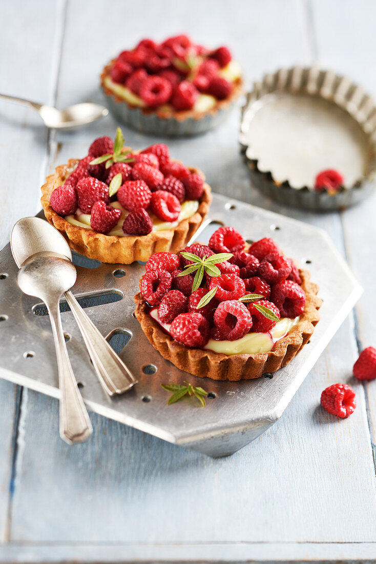 Raspberry tartlets with verbena syrup