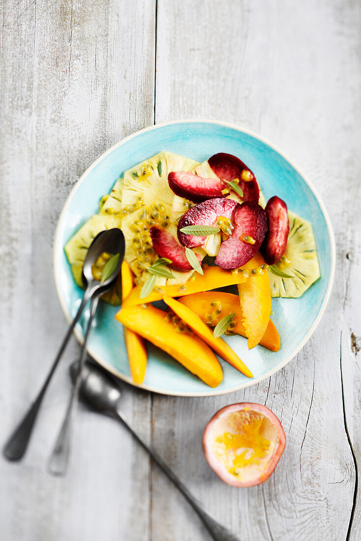 Exotic fruit salad with Victoria pineapple, wild mango, peaches and passion fruit