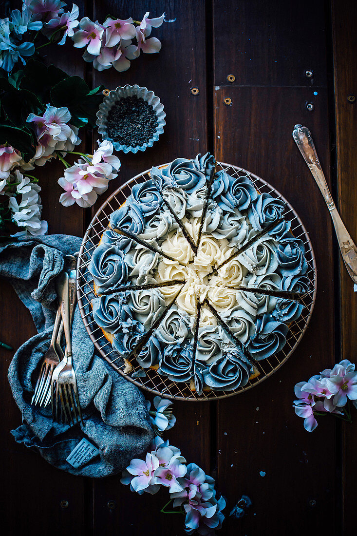 Black sesame and vanilla cake decorated with creme rosettes