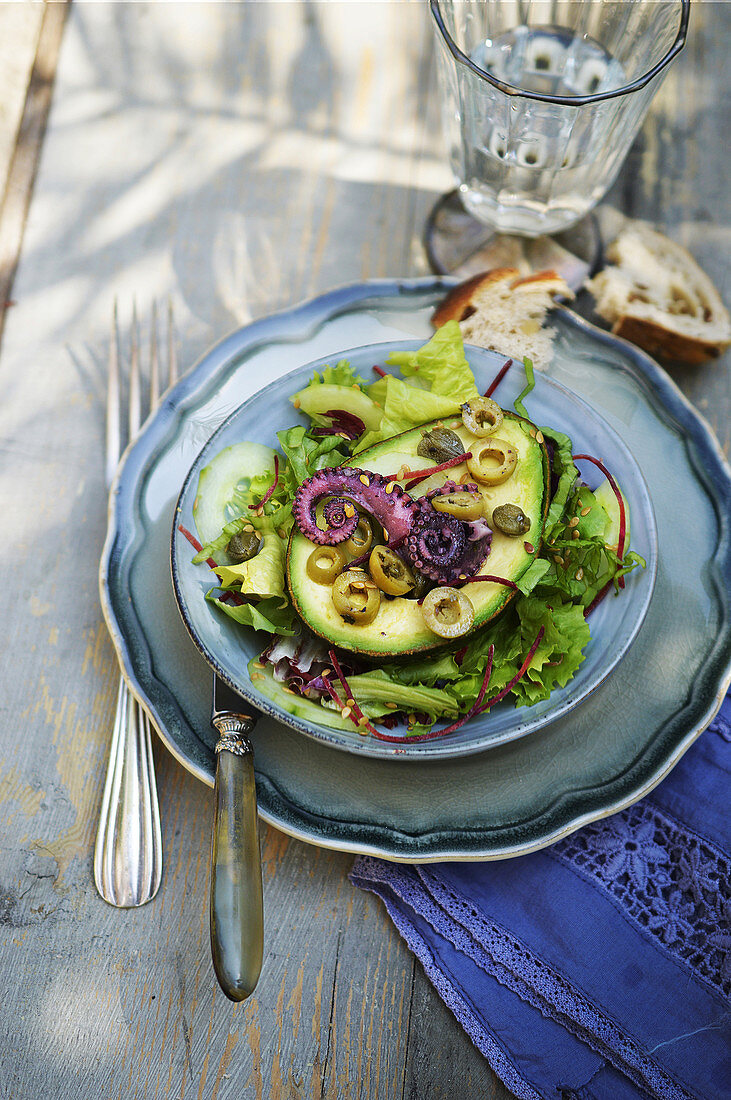 Avocado stuffed with squid, capers and olives