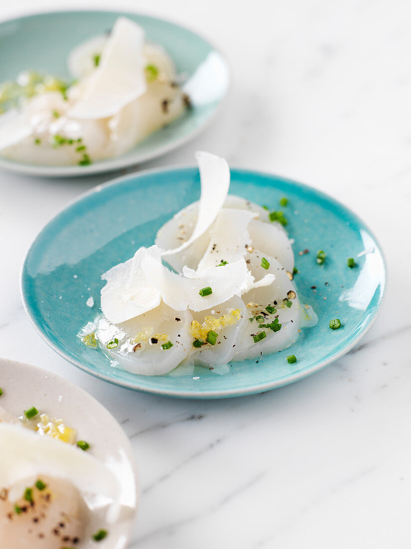 Scallop carpaccio with parmesan cheese