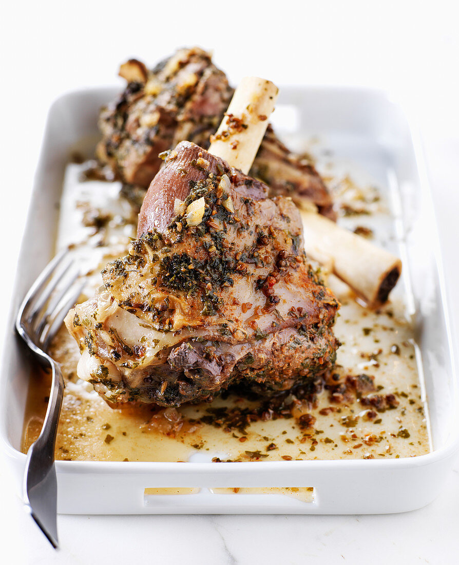 Leg of lamb cooked in a tagine with herbs and garlic