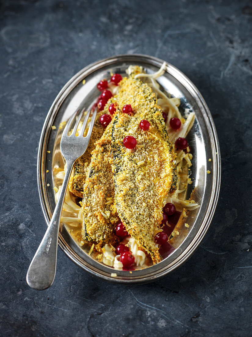 Fried breaded sardines with red currants