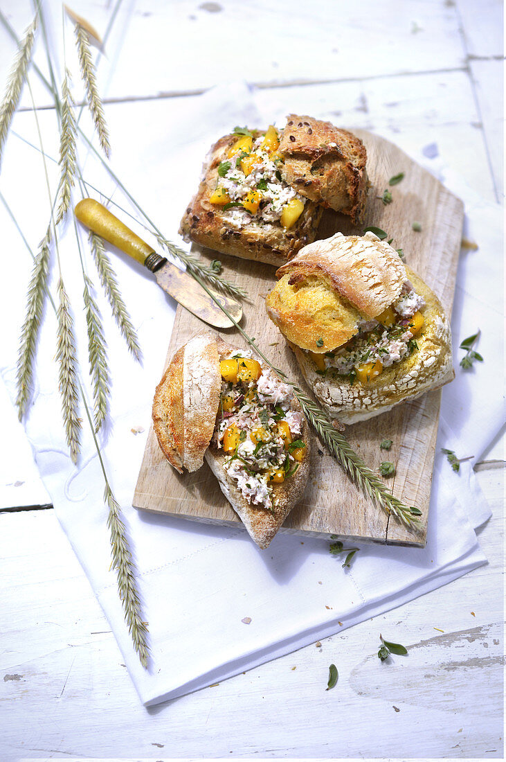 Rolls with tuna cream, peaches and herbs