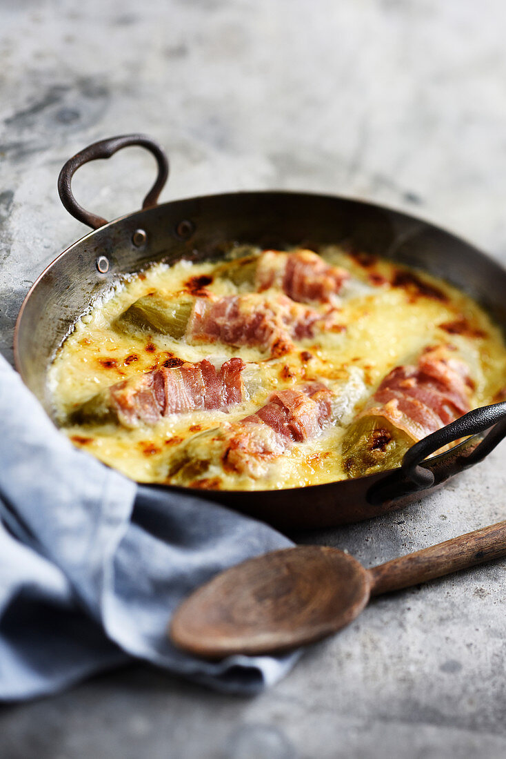 Chicory au gratin wrapped in bacon