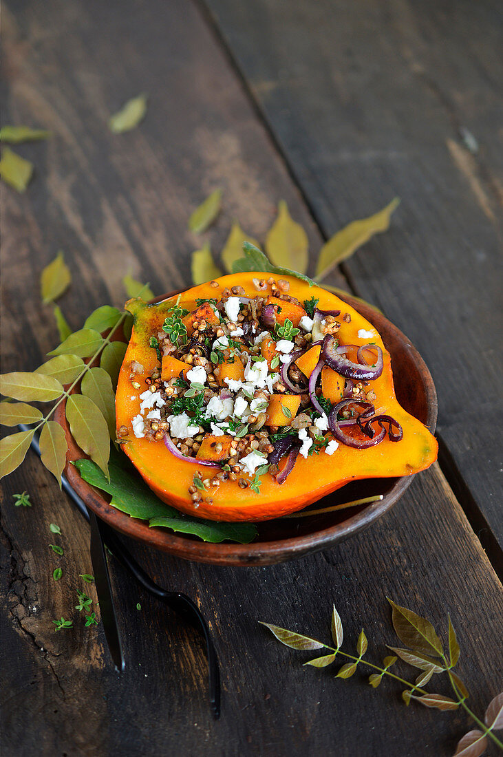 Pumpkin stuffed with buckwheat, feta, and red onion with herbs