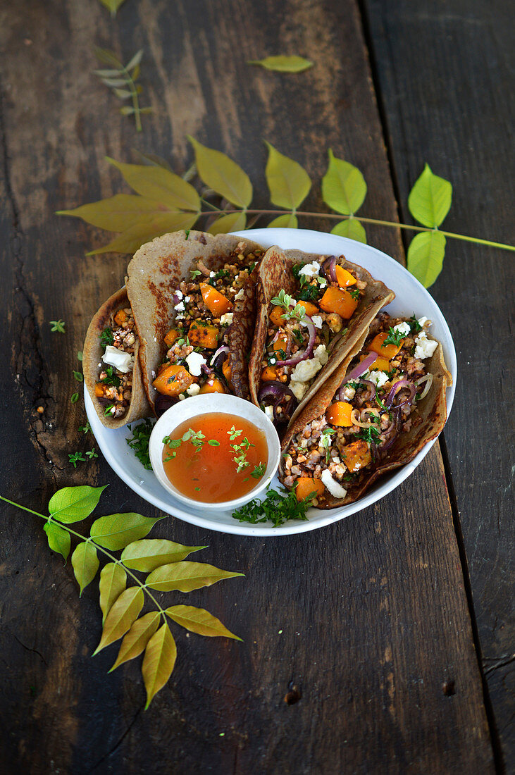 Buckwheat fajitas with pumpkin, feta, red onion and herbs