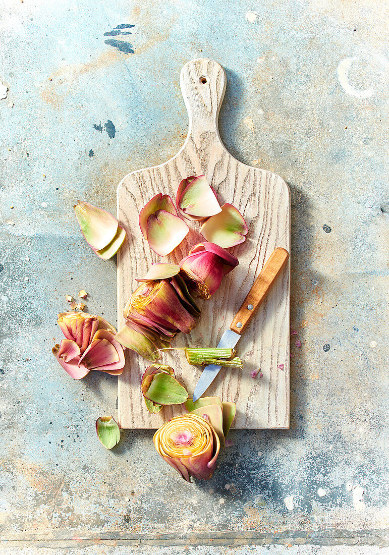 Preparing artichokes: Removing leaves from artichoke heart