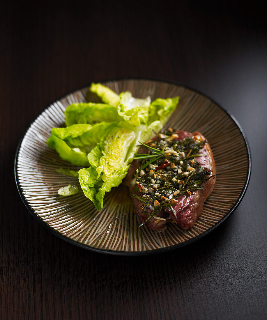 Slice of leg of lamb with herbs