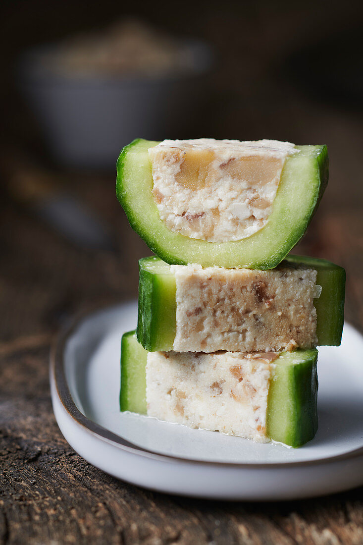 Cucumber slices stuffed with fresh cheese and chestnut
