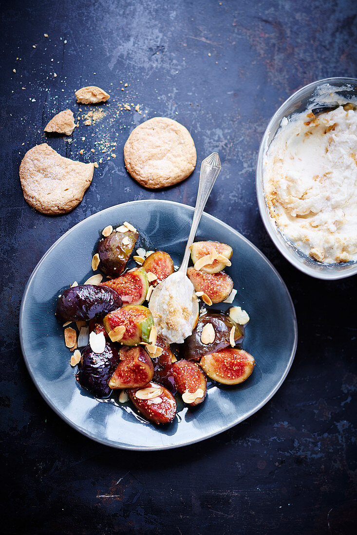 Grilled figs cooked on a flat plate grill with almonds