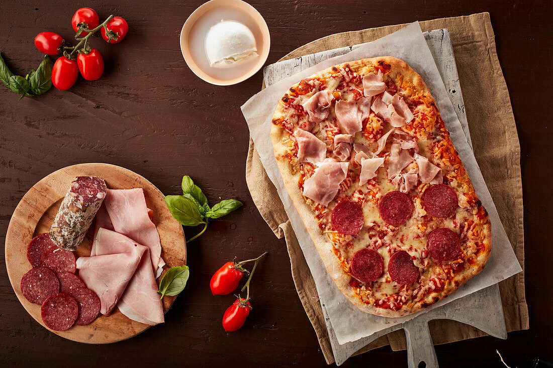 Pizza with ham and salami